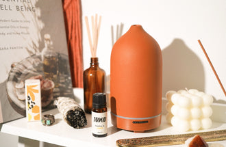 Aromatherapy Diffuser with essential oils and candles at home
